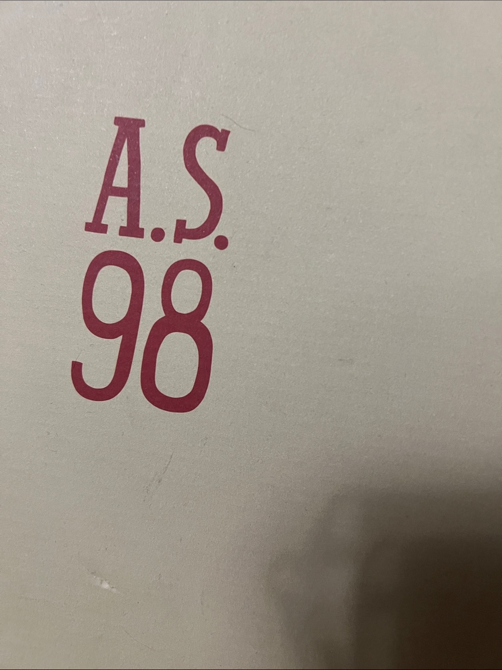 A.S.98 Pink Logo on Cream Surface